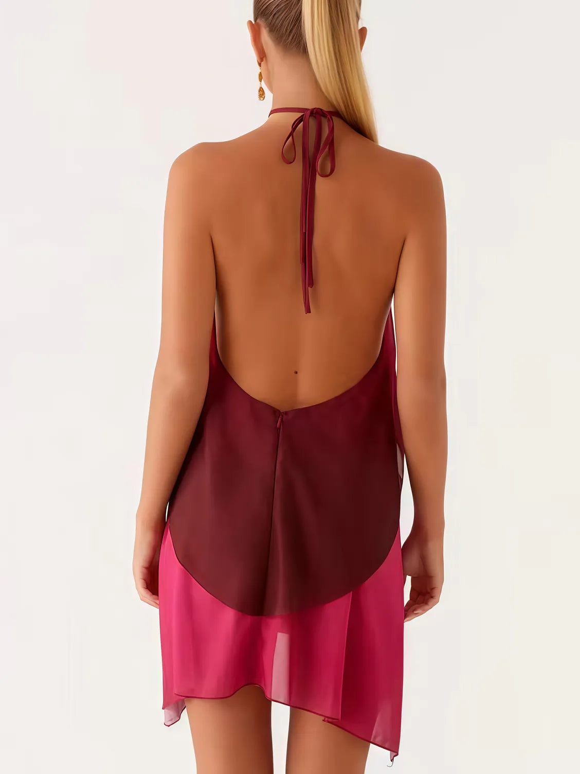 Woman wearing a burgundy and pink dress with a halter neck design on a white background. #Color_DarkRed