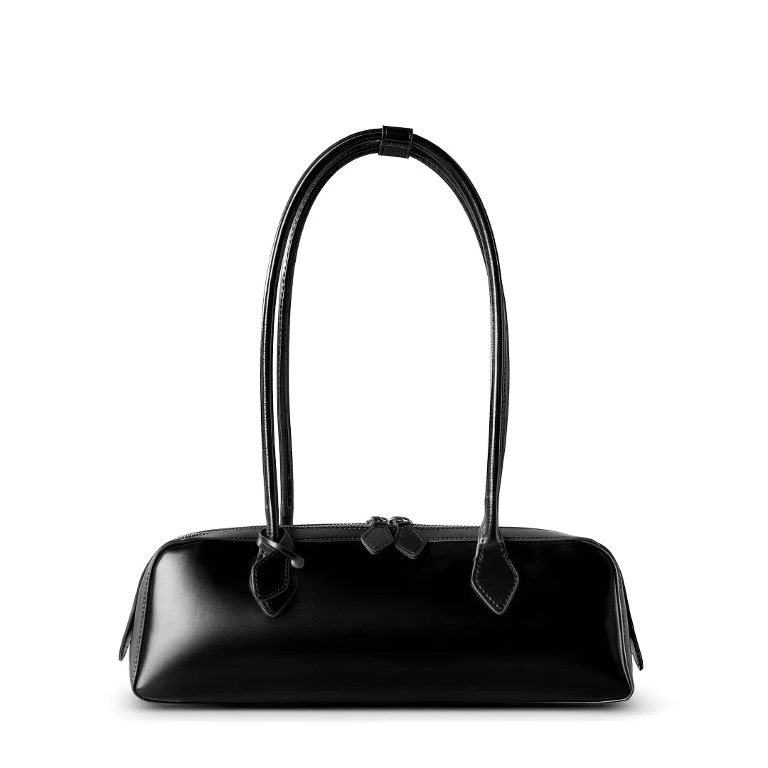 Black handbag with a bow detail on a white background #Color_Black