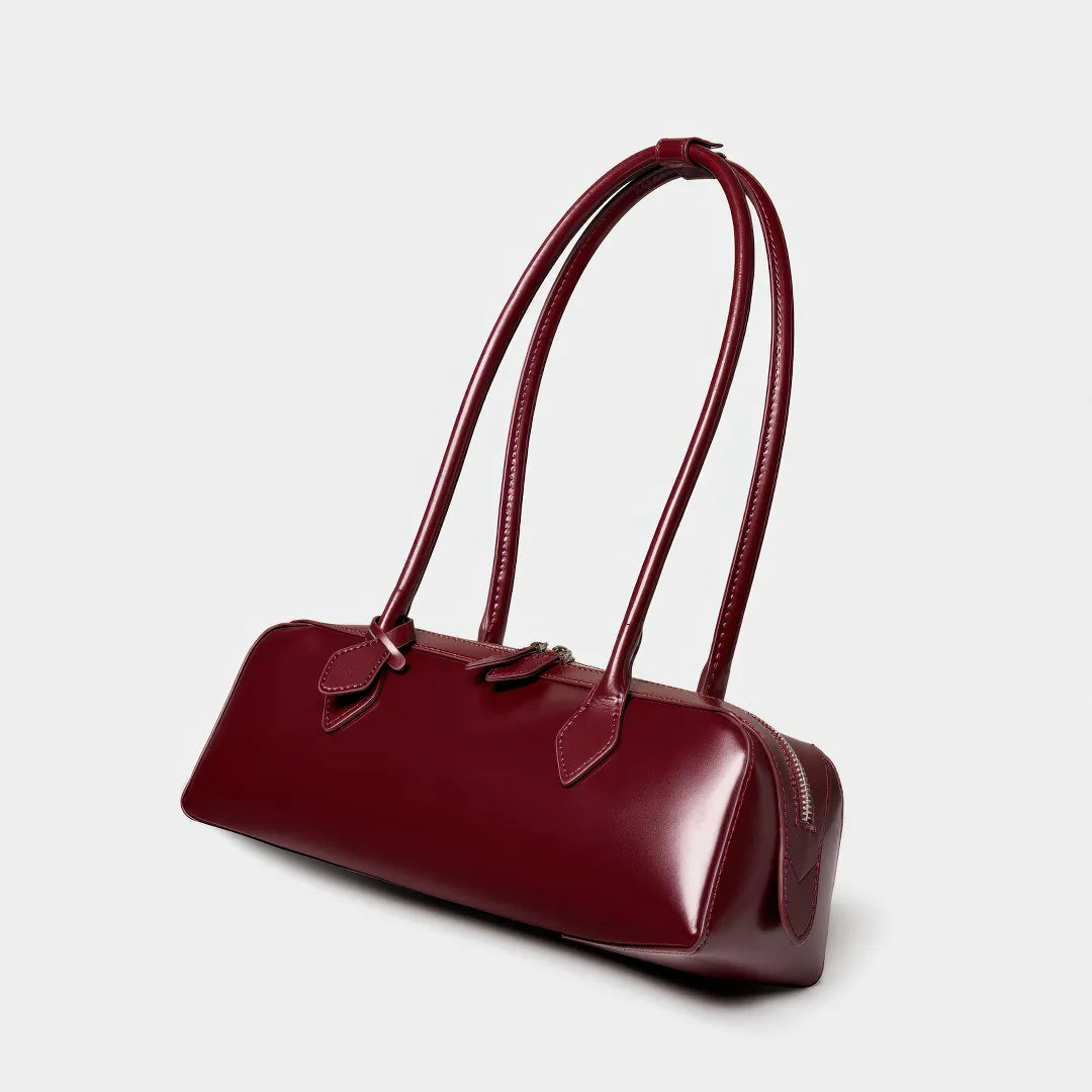 Maroon handbag with handles on a light gray background #Color_Red