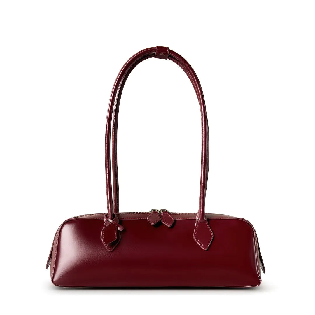 Maroon handbag with a bow detail on a white background #Color_Red