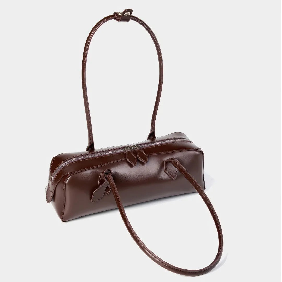 Brown handbag with a strap on a light gray background #Color_Brown