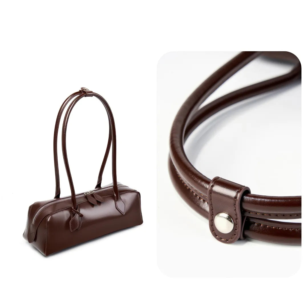 Brown leather handbag and strap on a white background #Color_Brown