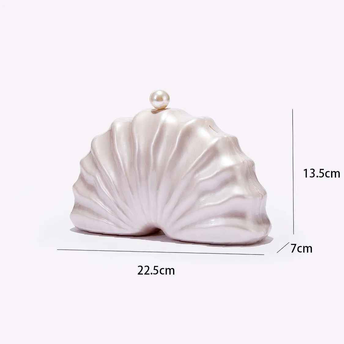 Shell-shaped clutch bag with measurements on a white background. #Color_PearlWhite