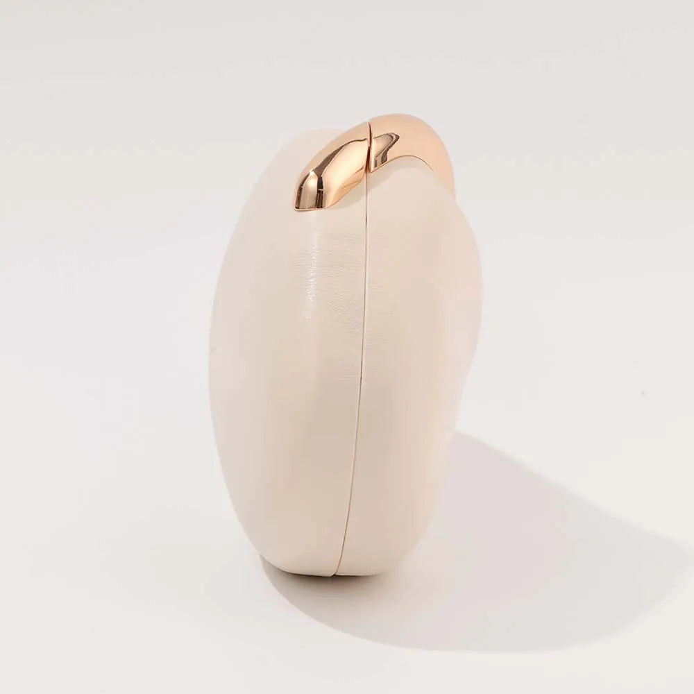 Cream-colored electronic device with gold accent on a light gray background. #Color_Beige