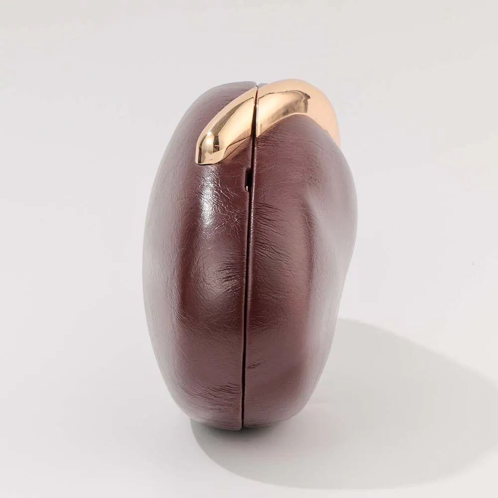 DarkRed coffee bean-shaped object with a gold accent on a white background. #Color_DarkRed