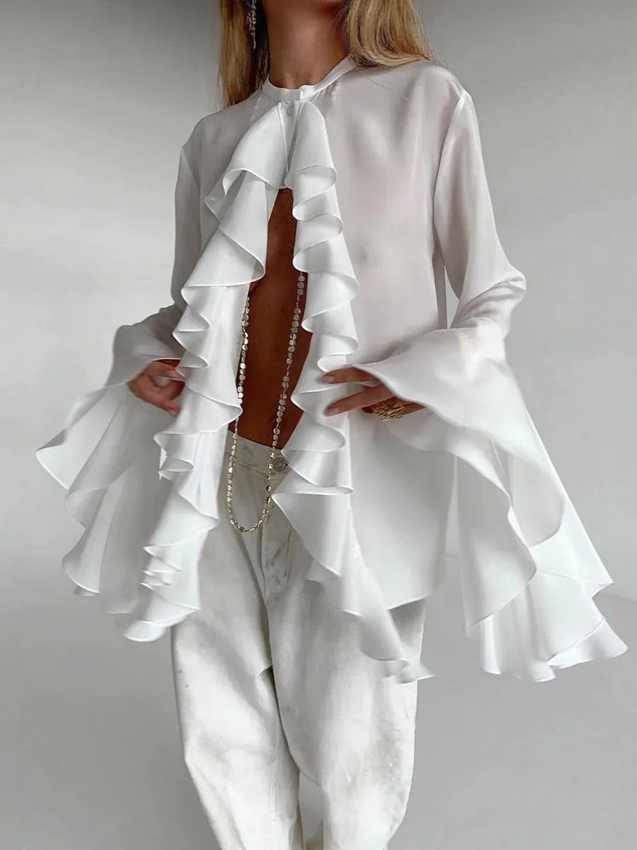 White ruffled outfit on a plain background #Color_White