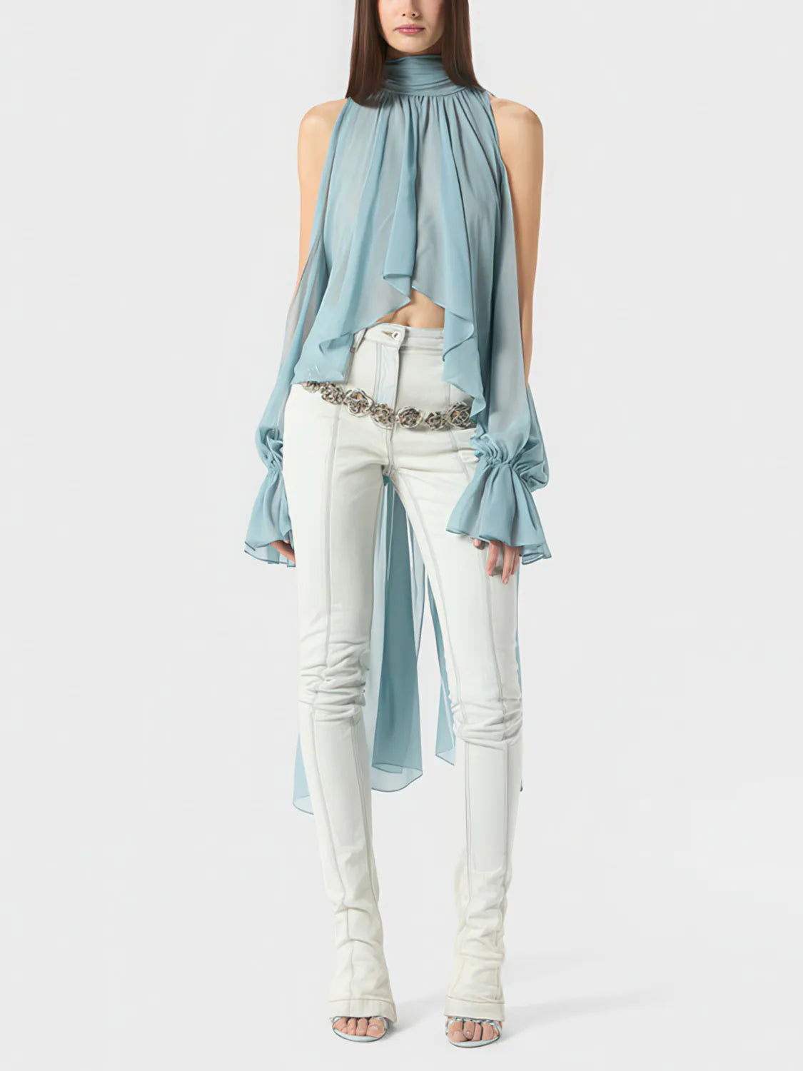 Woman wearing a light blue top and white pants with a belt on a white background. #Color_Blue