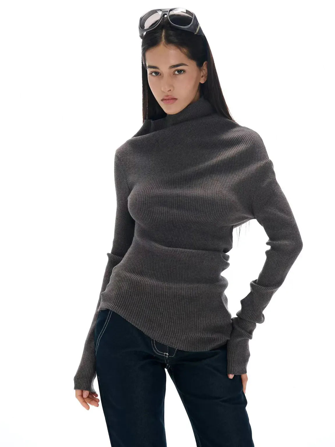 Woman wearing a gray turtleneck sweater on a white background.#Color_Gray