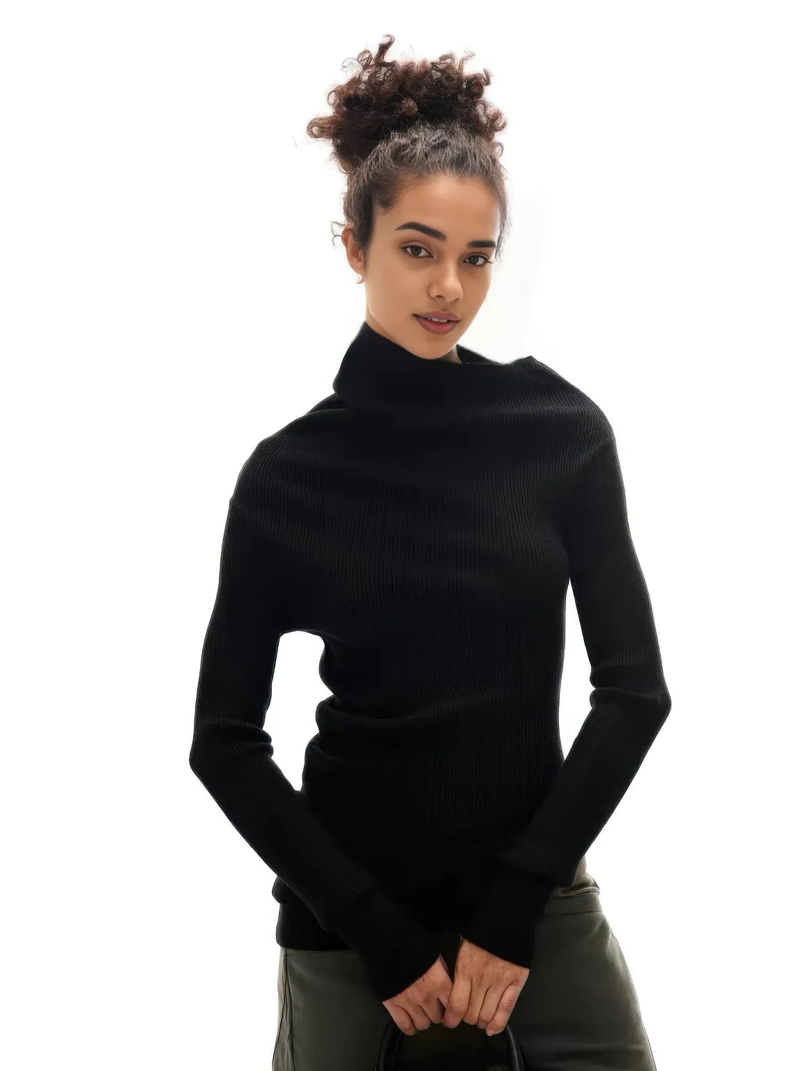 Woman wearing a black turtleneck sweater on a white background.#Color_Black