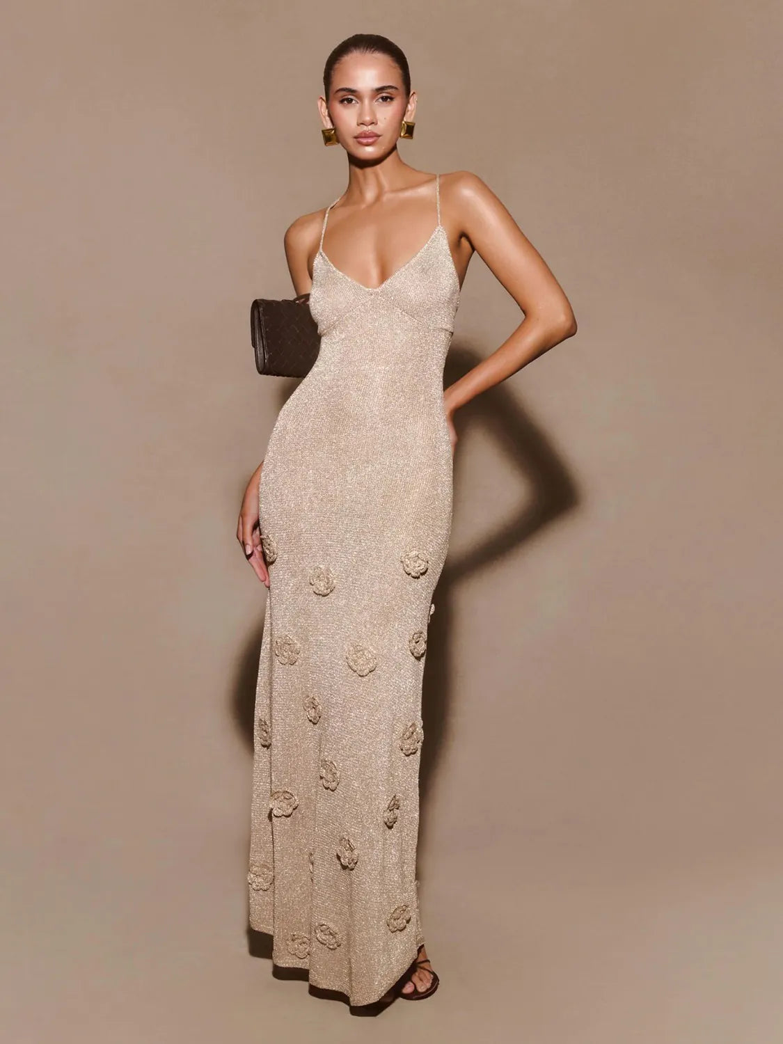 Woman wearing a beige evening gown with floral patterns against a beige background #Color_Linen