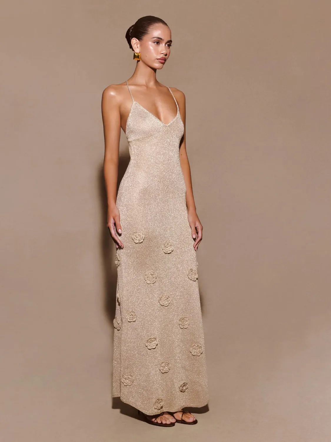 Woman wearing a beige floral dress against a beige background #Color_Linen