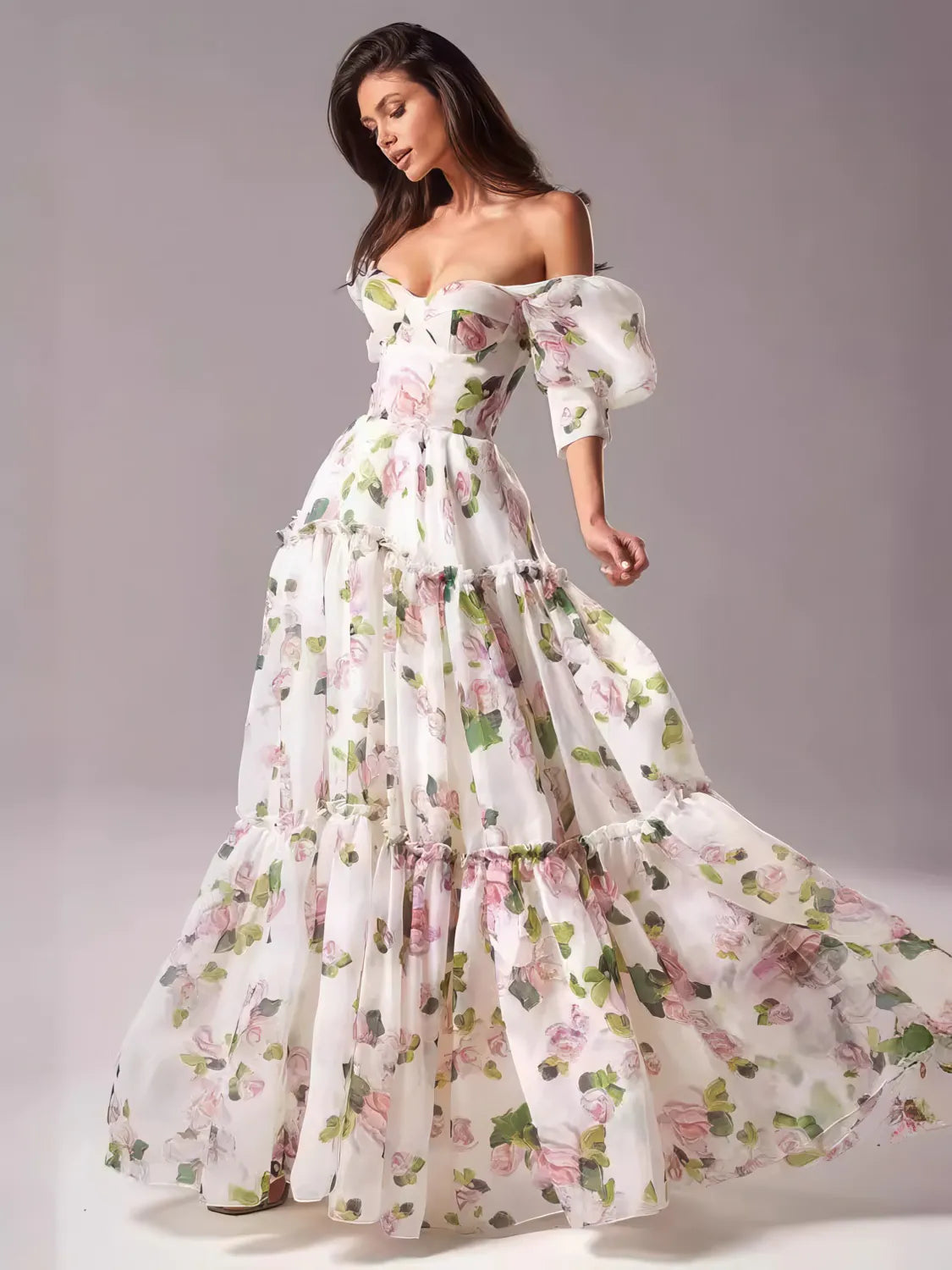 Woman wearing a floral off-shoulder gown on a gray background. #Color_Pink
