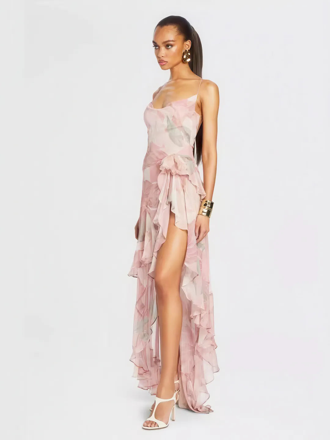 Woman wearing a pink floral dress on a white background