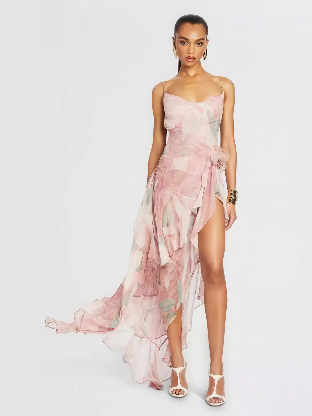 Woman wearing a floral one-shoulder dress on a white background