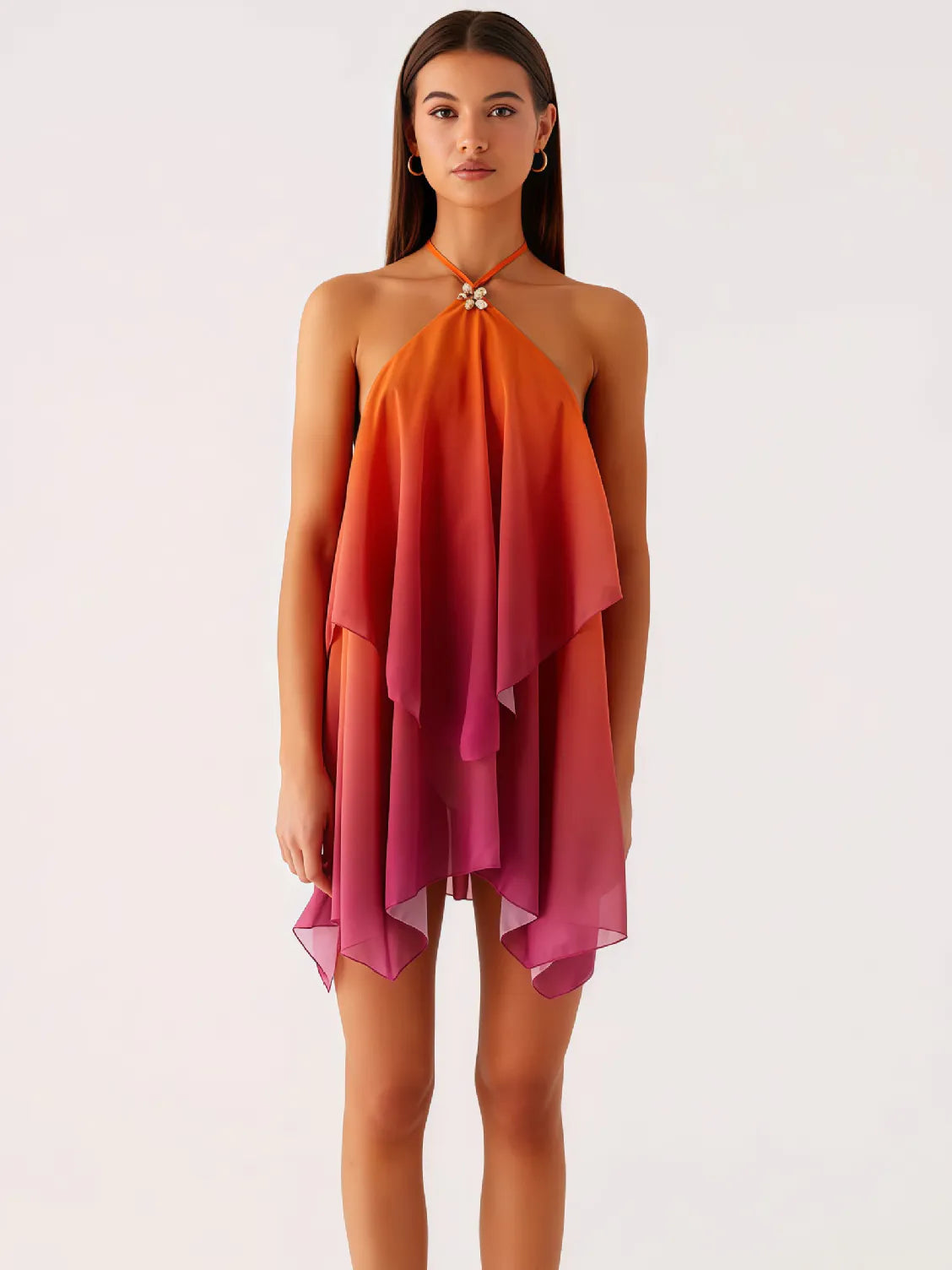 Woman wearing a halter neck dress with an ombre effect from orange to pink on a white background. #Color_OrangeRed