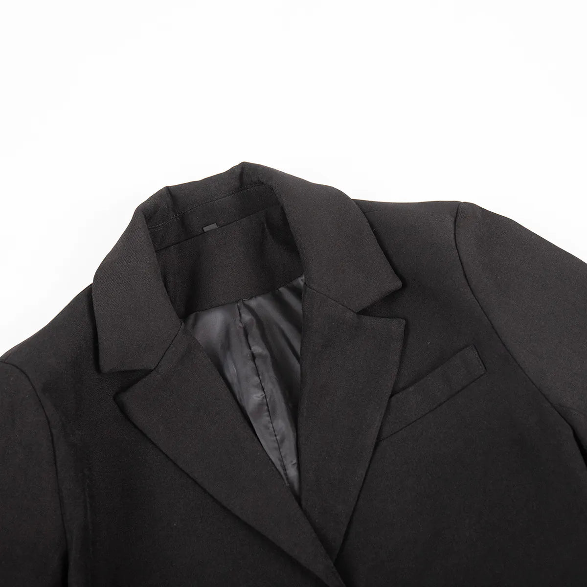 Close-up of a black coat with a white background. #Color_Black