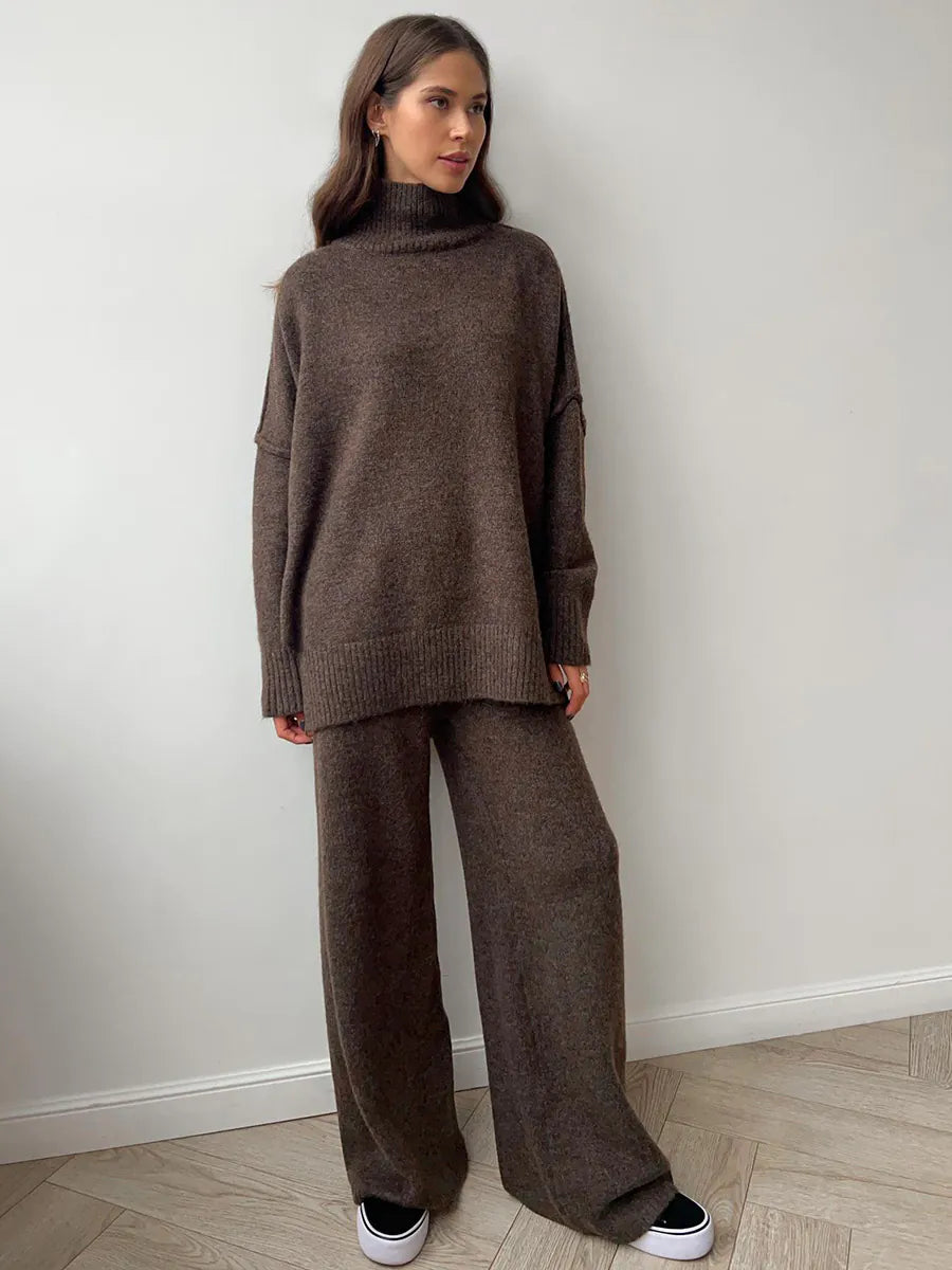 Woman wearing a brown knit outfit against a white wall. #Color_Coffee