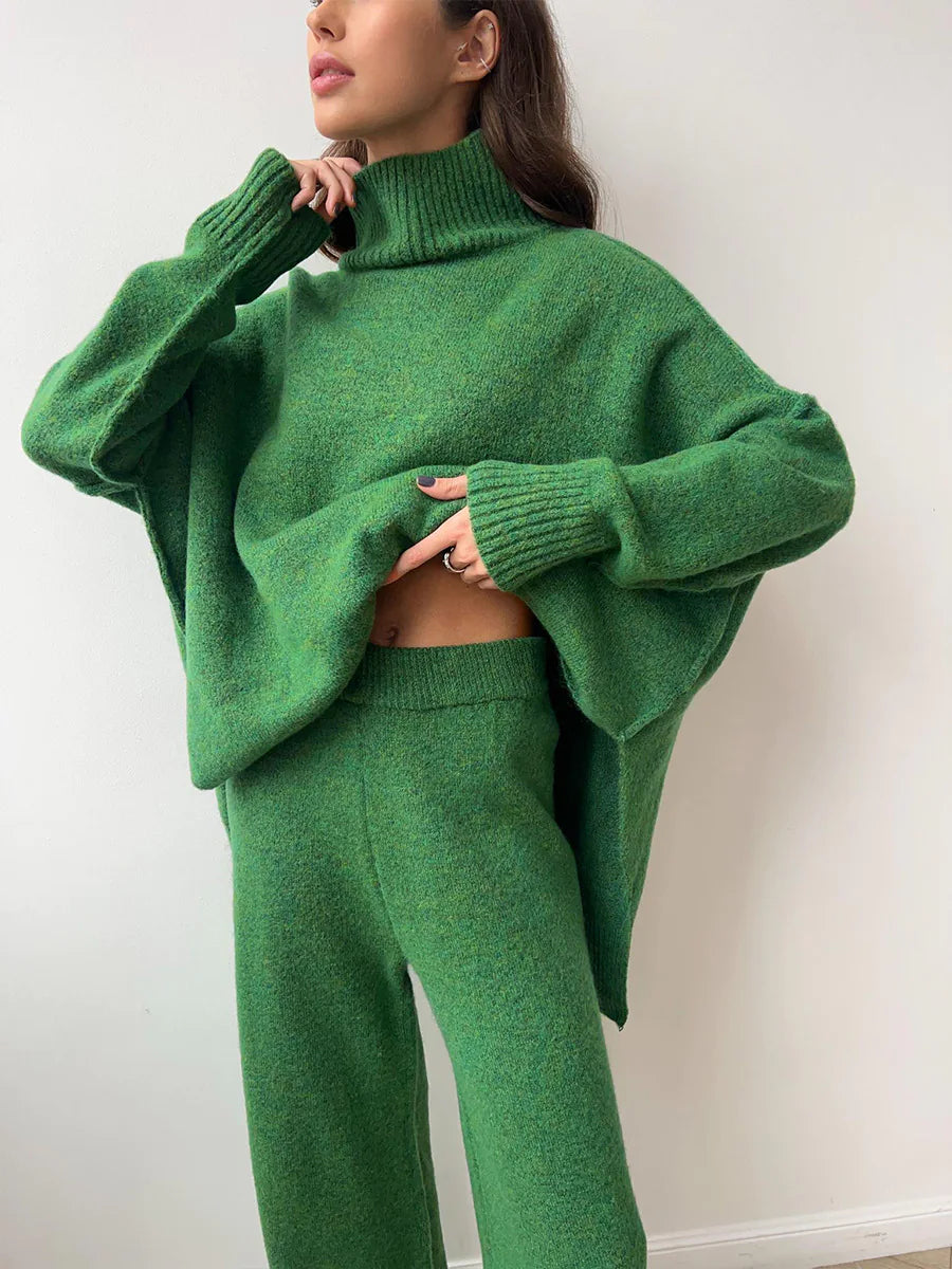 Person wearing a green knit outfit against a white background. #Color_DarkGreen