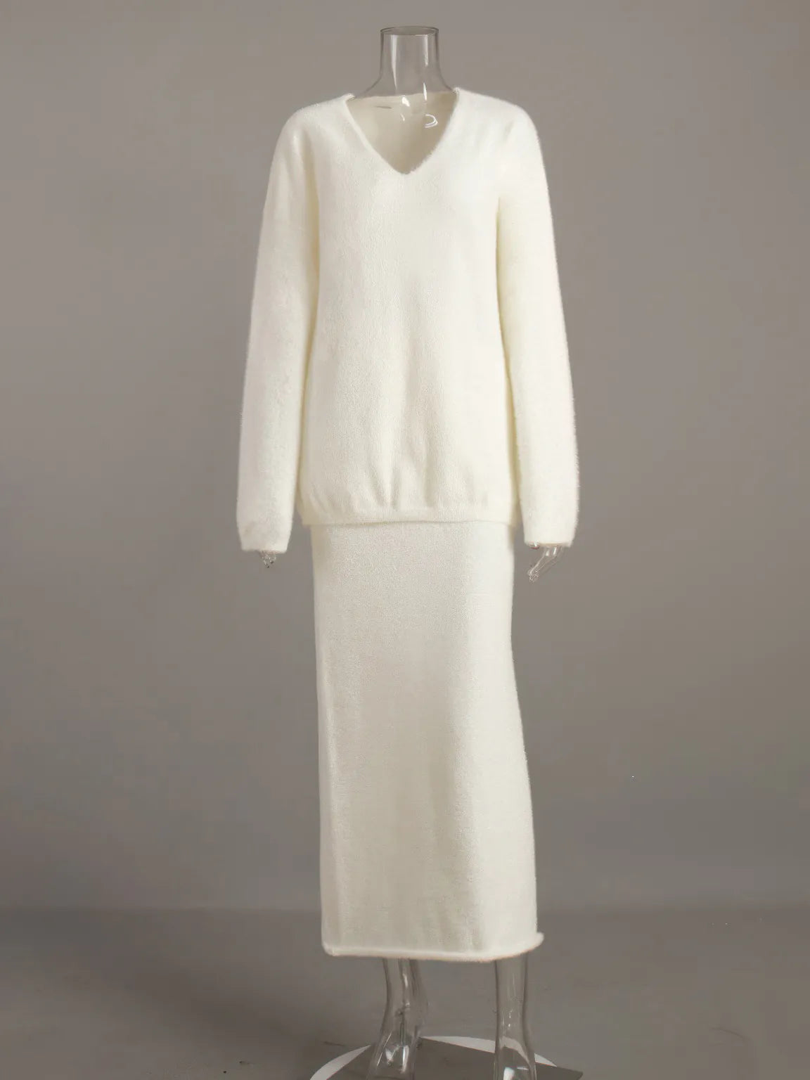 White dress on a mannequin against a plain background. #Color_White