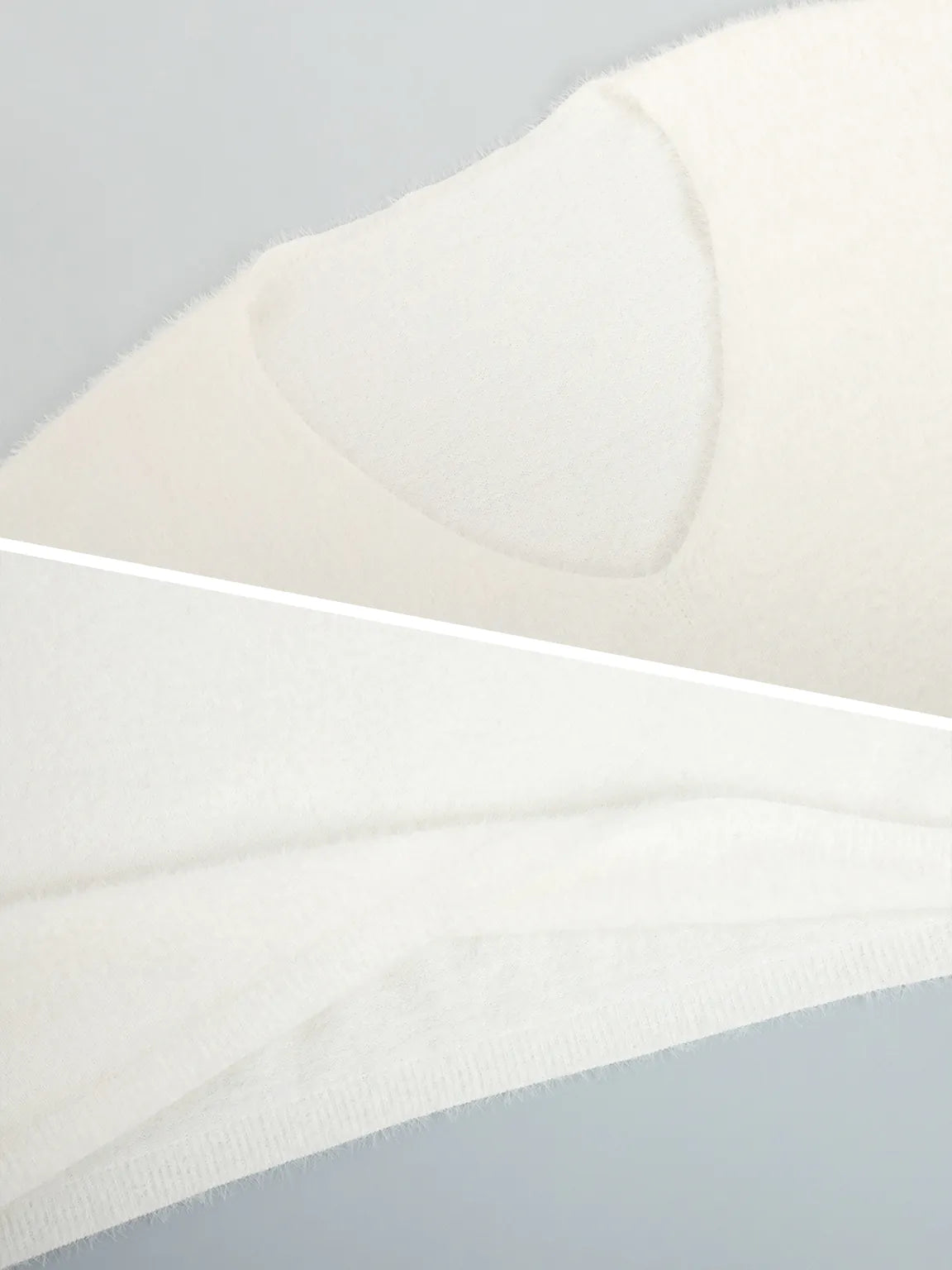 Close-up of a fabric with a geometric pattern on a light gray background. #Color_White